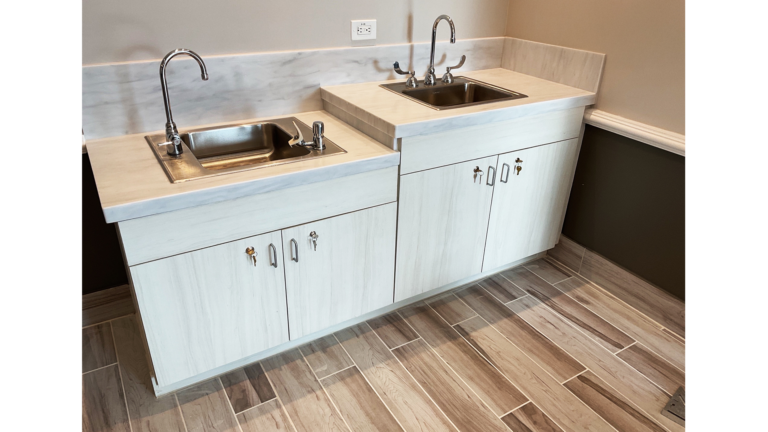 Utility area with two sinks and base cabinet unit at Prescolaire Early Learning Academy Spring, built by Keeton Construction Services, Spring, TX