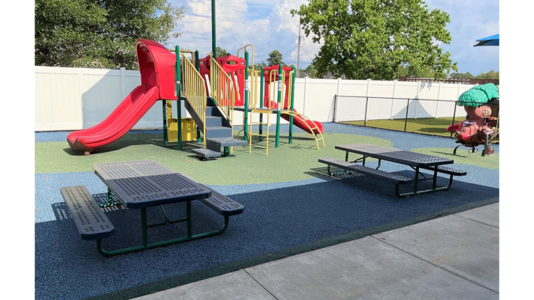 Outdoor playground area with play structure, slide, and picnic tables at Prescolaire Early Learning Academy Spring, Keeton Construction Services, Spring, TX