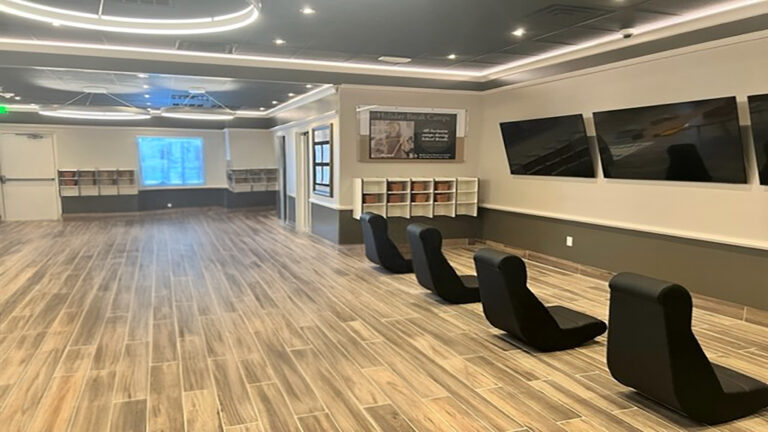 Large interior activity room with wall-mounted screens at Prescolaire Early Learning Academy Spring, Keeton Construction Services, Spring, TX