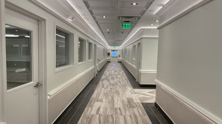 Interior hallway with interior-facing windows at Prescolaire Early Learning Academy Spring, built by Keeton Construction Services, Spring, TX