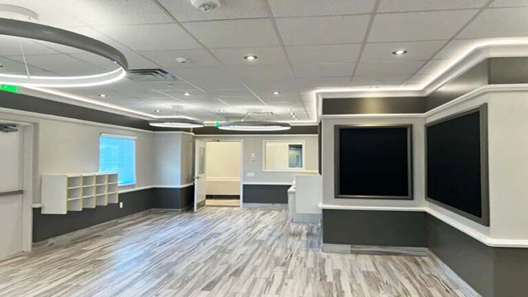 Interior classroom or activity space with wall-mounted screens at Prescolaire Early Learning Academy Spring, Keeton Construction Services, Spring, TX