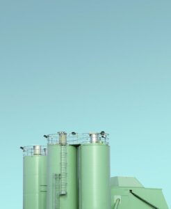 Green storage tanks after Houston commercial painting from Keeton Construction Services. 