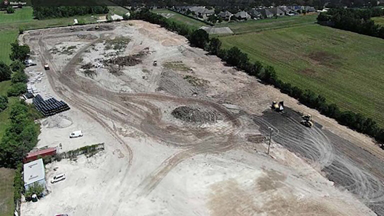 Aerial view of site clearing and grading work in progress for Ewald Kubota Equipment Dealership Rosenberg TX, Keeton Construction Services