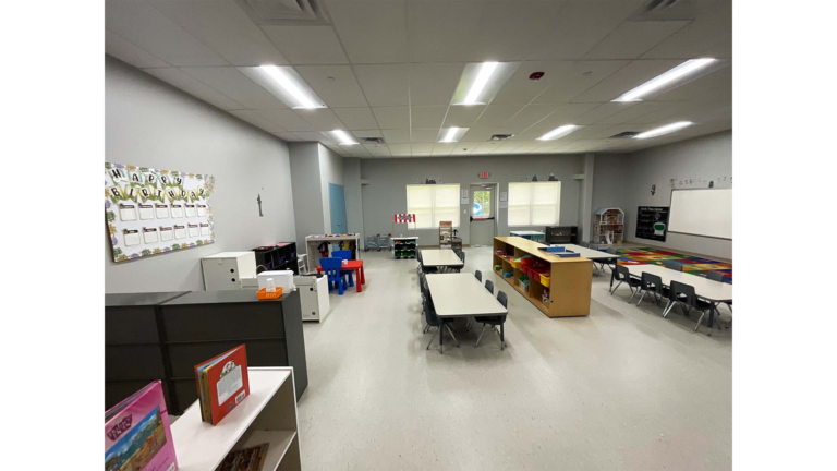 Little Texans Day Care Center interior classroom with tables, chairs and shelving units, Conroe, TX - Keeton Construction Services
