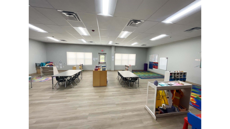 Little Texans Day Care Center interior classroom with tables, chairs and whiteboards, Conroe, TX - Keeton Construction Services