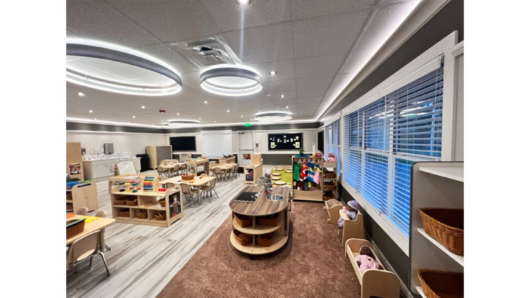 Classroom interior with circular ceiling lights and mixed furniture areas at Prescolaire Early Learning Academy Katy, Keeton Construction Services, Katy TX
