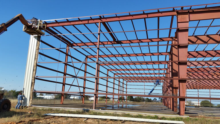 American Petroleum interior structural framing during construction with lift equipment visible, Houston, TX - Keeton Construction Services
