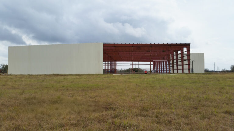 American Petroleum building exterior during construction showing partial enclosure and open framing, Houston, TX - Keeton Construction Services