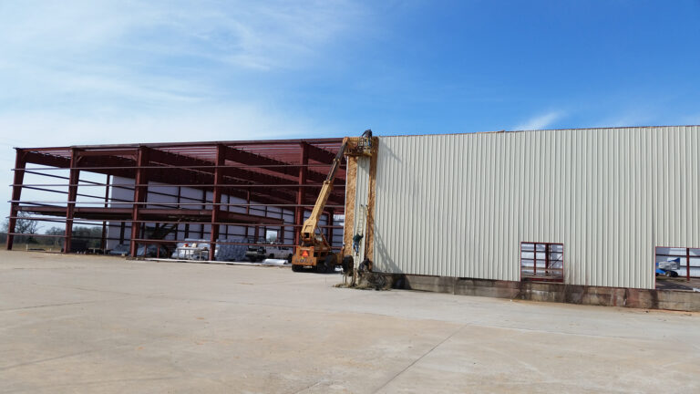 American Petroleum building exterior during construction with lift equipment at work, Houston, TX - Keeton Construction Services