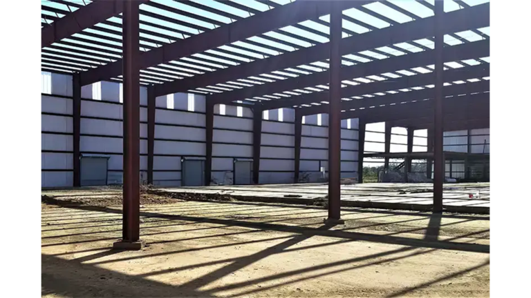 American Petroleum interior structural framing during construction with open sides and bare ground, Houston, TX - Keeton Construction Services