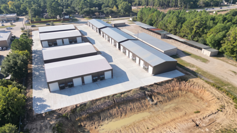 Aerial view of Spring Cypress Business Park in Tomball TX showing rows of metal buildings and paved drives, Keeton Construction Services