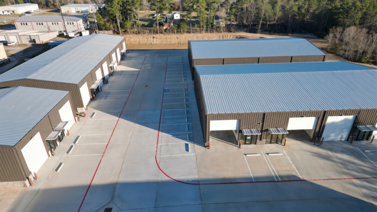Aerial view of Spring Cypress Business Park office warehouse flex space in Tomball TX showing metal buildings and large paved yard, Keeton Construction Services