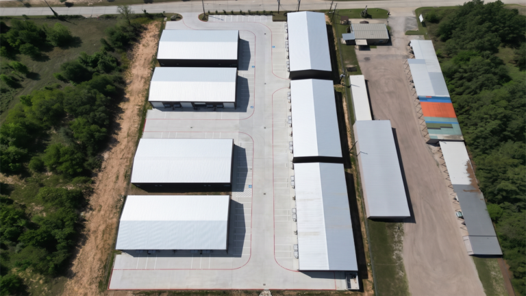 High aerial view of Spring Cypress Business Park in Tomball TX showing the complex of metal buildings and paved drives, Keeton Construction Services