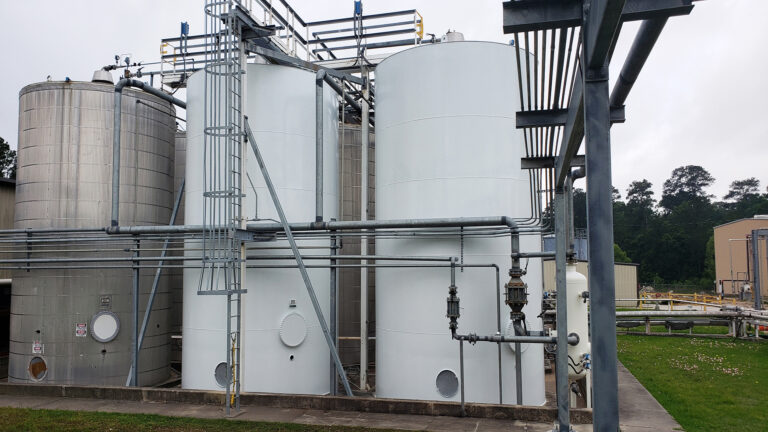 Univar Solutions Waller industrial tanks and piping system, Waller TX - Keeton Construction Services project showing tanks with overhead and ground-level pipe runs
