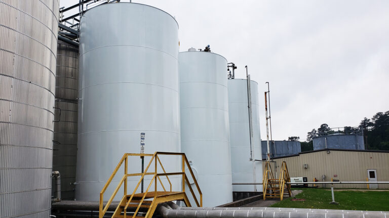 Univar Solutions Waller large industrial storage tanks with yellow access stairs, Waller TX - Keeton Construction Services project