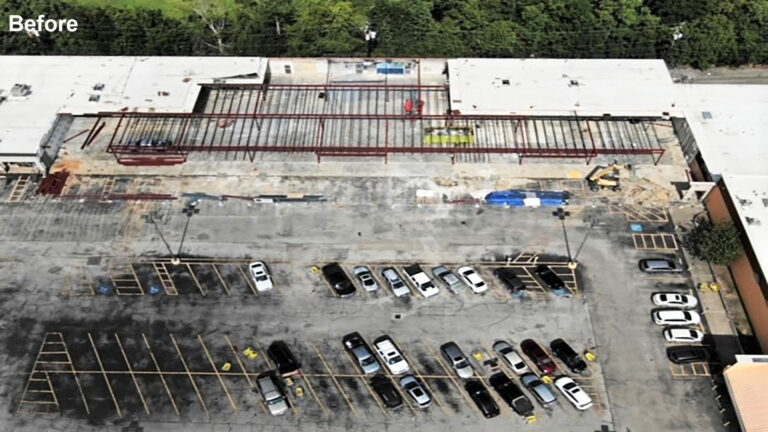 Aerial view of Fairmont Retail Center site before work began, showing steel frame and damaged parking area, Pasadena TX - Keeton Construction Services