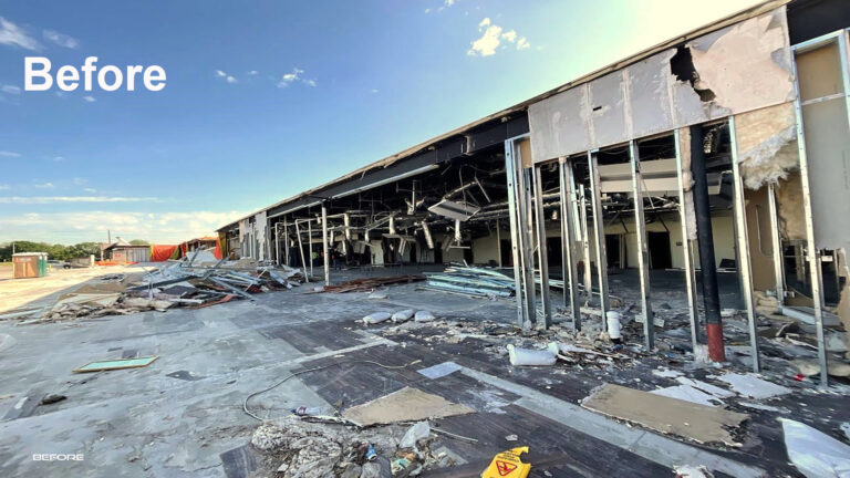 Fairmont Retail Center before work began, showing heavily damaged building exterior with debris and exposed framing, Pasadena TX - Keeton Construction Services