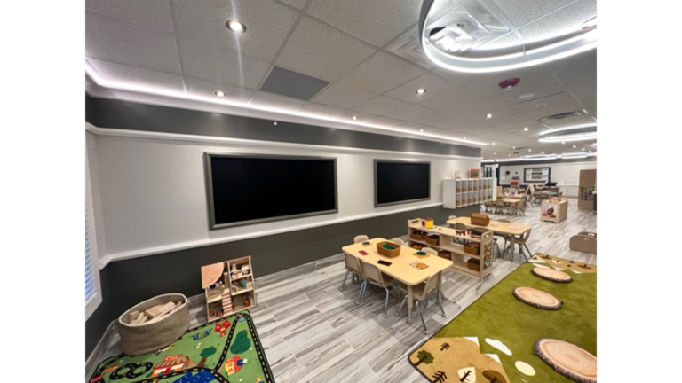 Classroom interior with display screens and child-sized tables at Prescolaire Early Learning Academy Katy, Keeton Construction Services, Katy TX