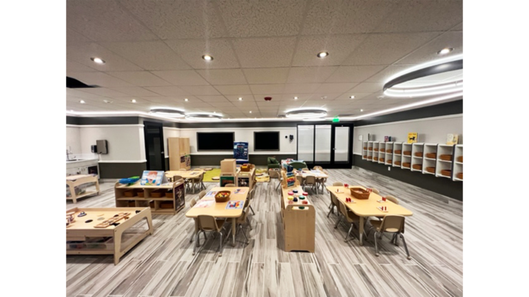 Large classroom interior with tables and storage units at Prescolaire Early Learning Academy Katy, Keeton Construction Services, Katy TX