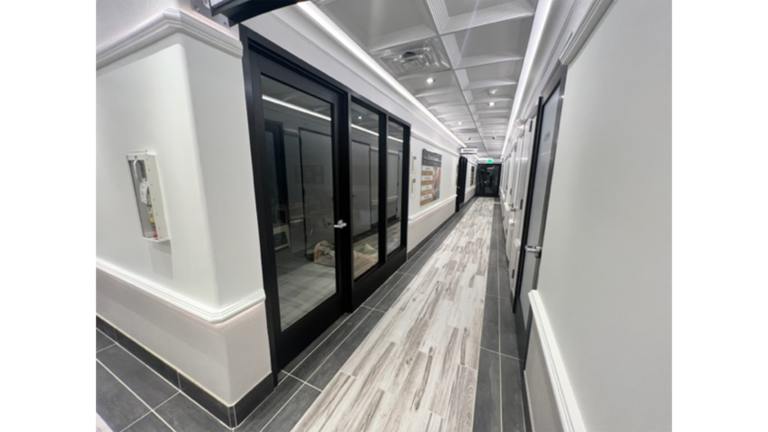 Interior hallway with glass-panel room doors at Prescolaire Early Learning Academy Katy, built by Keeton Construction Services, Katy TX