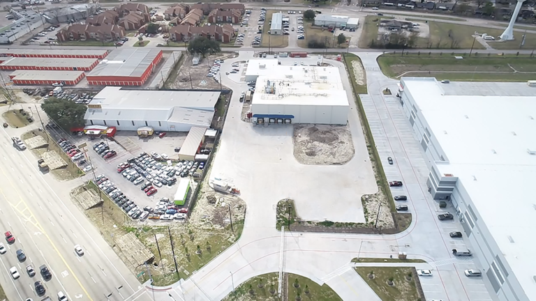 Aerial view of the Gourmet Foods site in Houston, TX showing buildings and parking area, by Keeton Construction Services