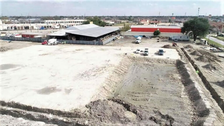 Aerial view of the Gourmet Foods site in Houston, TX showing grading and an excavated area with vehicles on site, by Keeton Construction Services