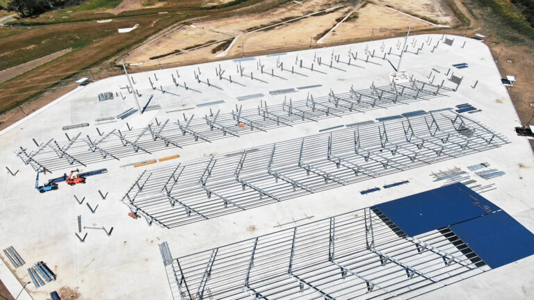 Lamar CISD Transportation Center Bus Canopies in Rosenberg TX - aerial close-up of canopy framing arrays during construction, Keeton Construction Services