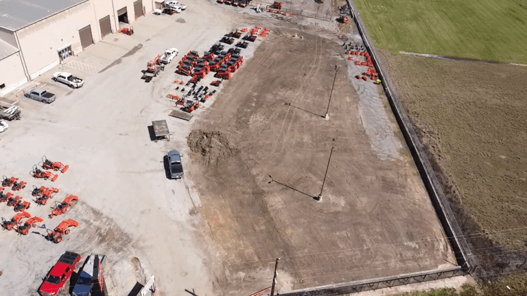 Aerial view of site work in progress at the Ewald Kubota Equipment Dealership in Hockley, TX, by Keeton Construction Services, showing a graded pad next to the existing yard