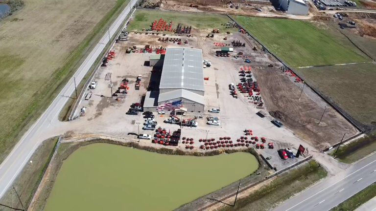 Aerial view of the Ewald Kubota Equipment Dealership site in Hockley, TX, built by Keeton Construction Services, showing the main building and equipment yard