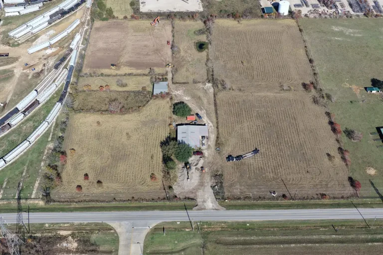 Aerial view of the Madden Bolt Corporation project site before construction in Hockley, TX by Keeton Construction Services, showing undeveloped agricultural land