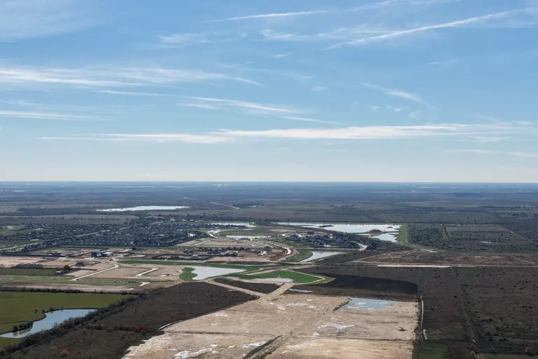 High-altitude aerial view of the surrounding area near the Madden Bolt Corporation project in Hockley, TX by Keeton Construction Services, showing flat rural landscape