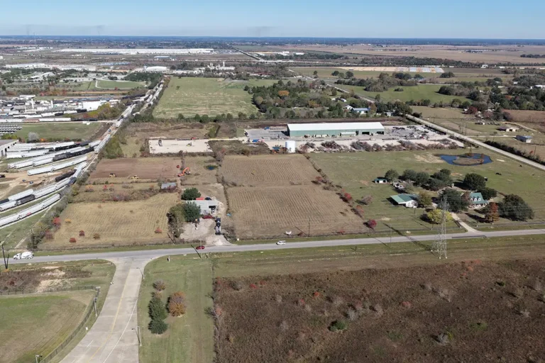 Aerial view of the Madden Bolt Corporation project area in Hockley, TX by Keeton Construction Services, showing open land and existing industrial buildings in the distance