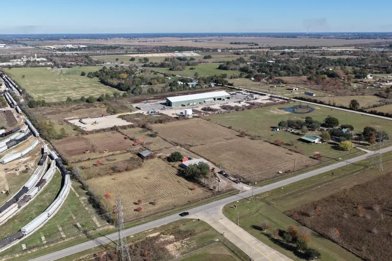 Aerial view of the Madden Bolt Corporation site in Hockley, TX by Keeton Construction Services, with a highway interchange visible and an existing building in the background