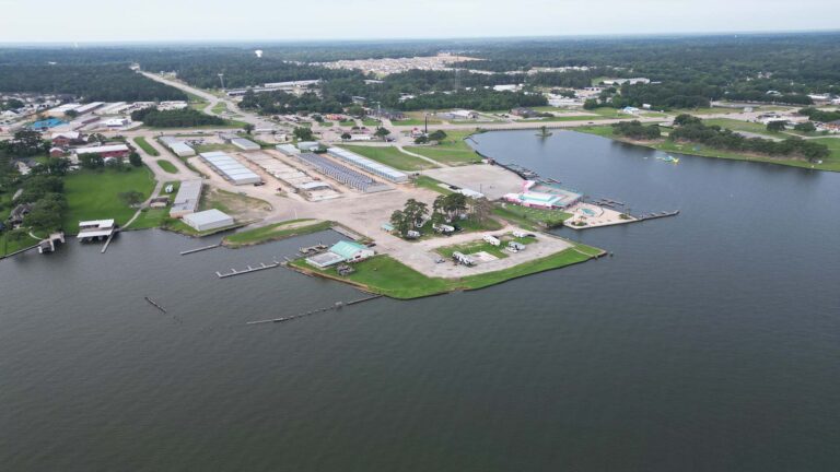 Wide aerial view of Lakeview Marina Boat Storage site and surrounding waterway in Conroe, TX by Keeton Construction Services