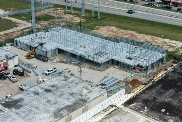 H-Town Public Storage in Houston, TX - aerial view of the building under construction next to an existing commercial area, by Keeton Construction Services