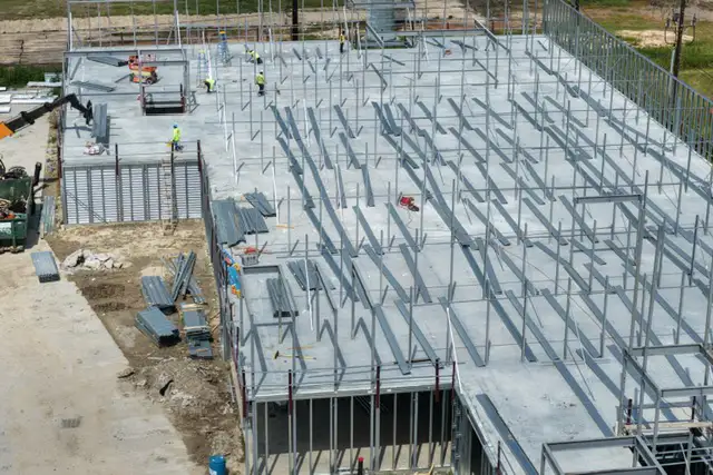 H-Town Public Storage in Houston, TX - aerial view of the framing and structural work in progress with workers on site, by Keeton Construction Services