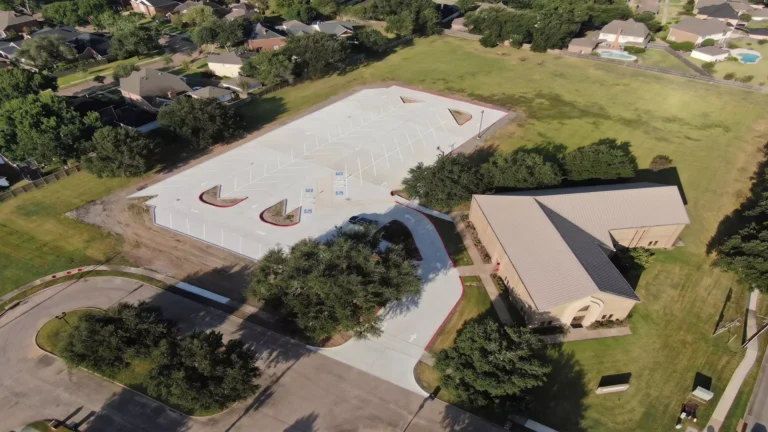 Aerial view of the new concrete parking lot and entry drive at Providence Presbyterian Church in Sugar Land, Texas